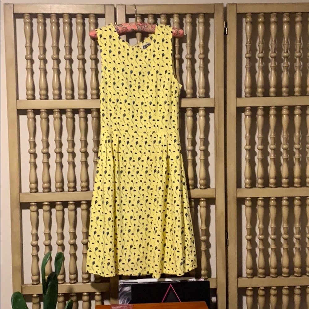 Yellow dress with kites and clouds
